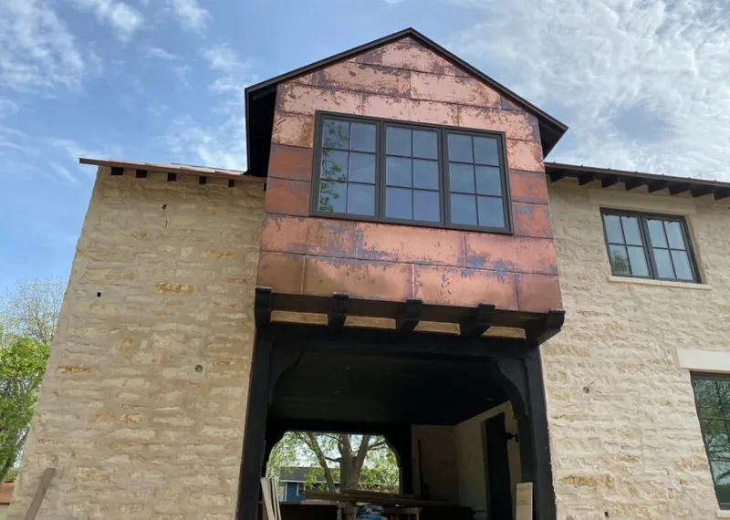 Copper metal panel facade on a stone building for Skylight Installation in Highland Heights